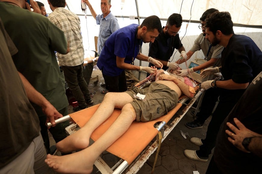 A wounded Palestinian Christian man receives medical attention at Al-Ahli Arab Hospital following an Israeli strike on The Church of the Holy Family, according to medics, in Gaza City July 17, 2025. REUTERS/Dawoud Abu Alkas