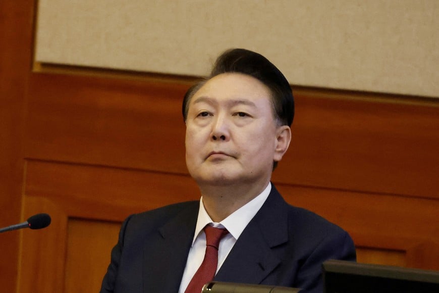 FILE PHOTO: South Korea’s impeached President Yoon Suk Yeol attends the fourth hearing of his impeachment trial over his short-lived imposition of martial law at the Constitutional Court in Seoul, South Korea, 23 January 2025.    JEON HEON-KYUN/Pool via REUTERS/File Photo