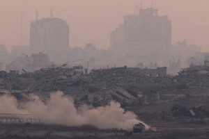 An Israeli APC manoeuvres in Gaza, as seen from the Israeli side of the Israel-Gaza border, July 21, 2025. REUTERS/Amir Cohen