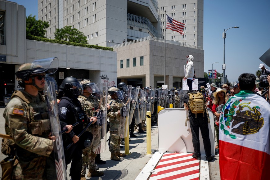 Members of the California National Guard stand guard outside the Edward R. Roybal Federal building, after days of protests against federal immigration sweeps and the deployment of the California National Guard and U.S. Marines, in downtown Los Angeles, California, U.S., June 10, 2025.   REUTERS/Mike Blake