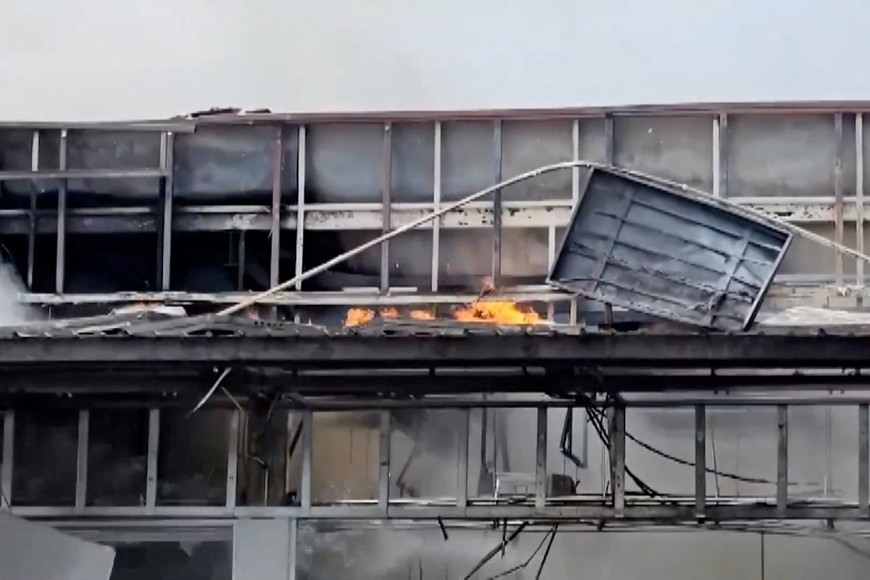Smoke and fire rise from a convenience store at a gas station, amid the clashes between Thailand and Cambodia, in Kantharalak district, Sisaket province, Thailand, July 24, 2025, in this screengrab obtained from a handout video.  TPBS/Handout via REUTERS    THIS IMAGE HAS BEEN SUPPLIED BY A THIRD PARTY. THAILAND OUT. NO COMMERCIAL OR EDITORIAL SALES IN THAILAND.