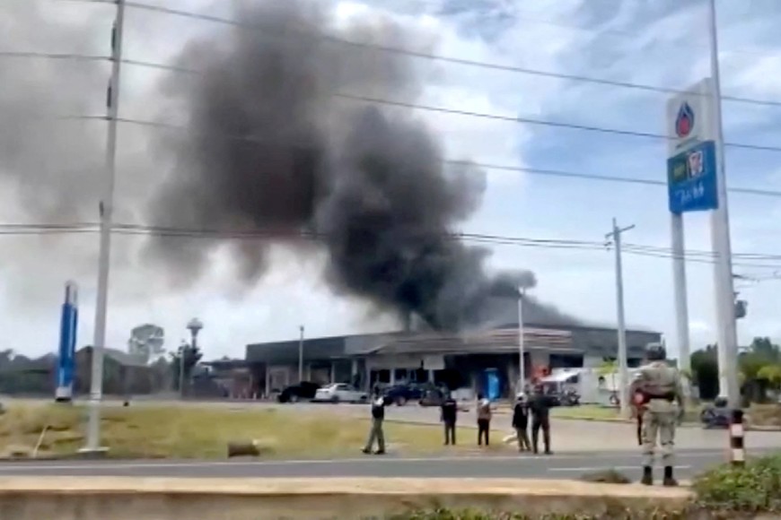 Smoke rises from a convenience store at a gas station, amid the clashes between Thailand and Cambodia, in Kantharalak district, Sisaket province, Thailand, July 24, 2025, in this screengrab obtained from a handout video.  TPBS/Handout via REUTERS    THIS IMAGE HAS BEEN SUPPLIED BY A THIRD PARTY. THAILAND OUT. NO COMMERCIAL OR EDITORIAL SALES IN THAILAND.