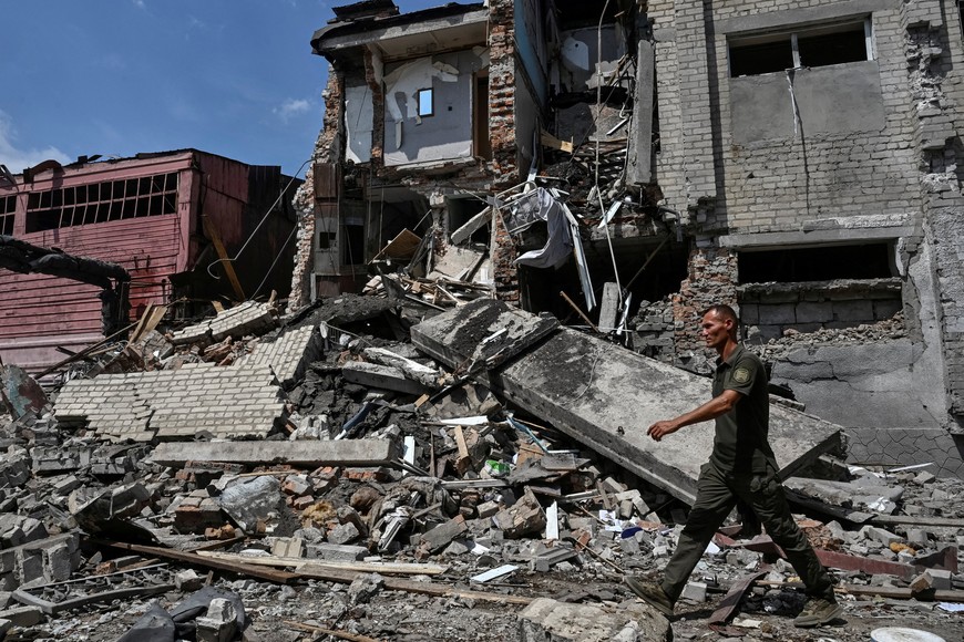 A serviceman walks at the site of the penal colony hit by a Russian air strike, amid Russia's attack on Ukraine, in Zaporizhzhia region, Ukraine July 29, 2025. REUTERS/Stringer     TPX IMAGES OF THE DAY