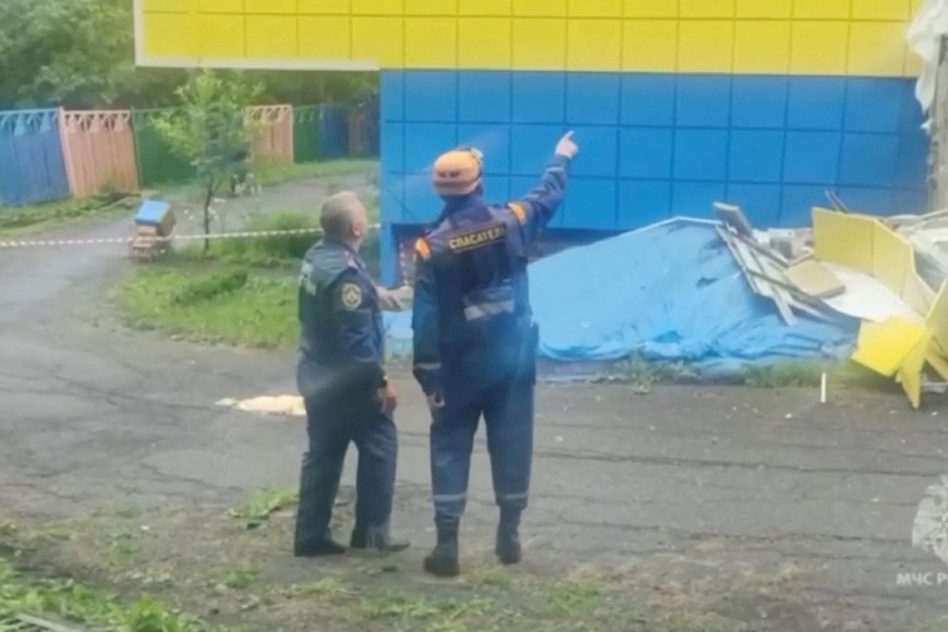 Emergency services personnel work at a kindergarten damaged by an earthquake, in Petropavlovsk-Kamchatsky, Kamchatka Krai, Russia, July 30, 2025 in this screen grab from handout video.    Russian Ministry for Emergencies/Handout via REUTERS    THIS IMAGE HAS BEEN SUPPLIED BY A THIRD PARTY. DO NOT OBSCURE LOGO.

Verification:
- Building, road layout, and building exteriors match file and satellite imagery
- Date confirmed by the corroborating local reports and official statements