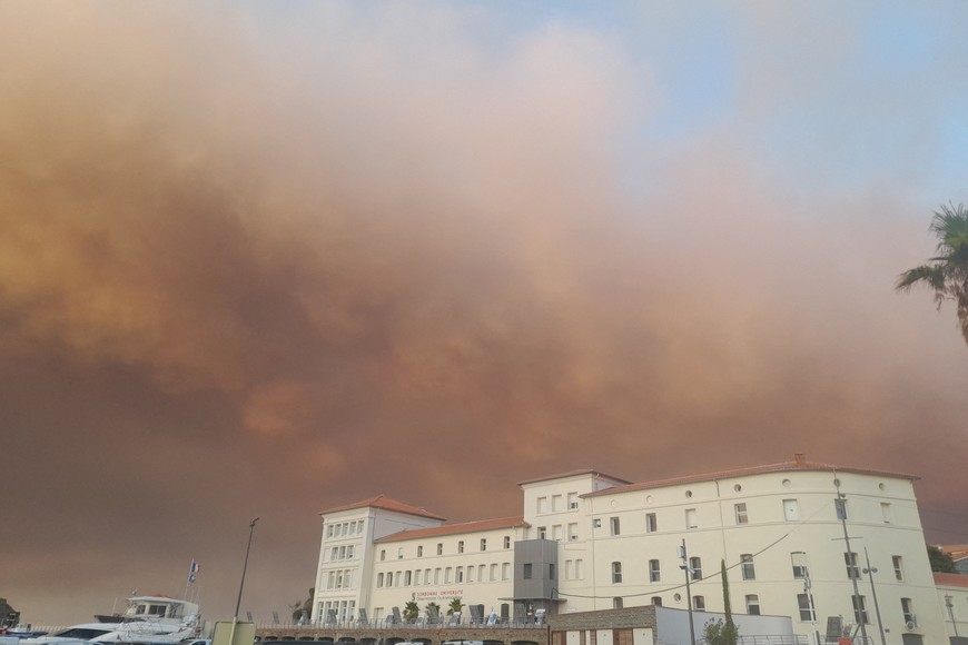 Smoke rises from a wildfire in Ribaute as seen from Banyuls-sur-Mer, Canton de La Cote Vermeille, France August 5, 2025 in this picture obtained from social media. @SAkhenat via X/via REUTERS  THIS IMAGE HAS BEEN SUPPLIED BY A THIRD PARTY. MANDATORY CREDIT. NO RESALES. NO ARCHIVES.

Verification: 

- Reuters was able to independently verify the location with the outline, design and position of the buildings that matched the file and satellite imagery of the area. 
- Reuters was able to independently verify the date with the original file metadata from the source and corroborating reports of the fire near the area.