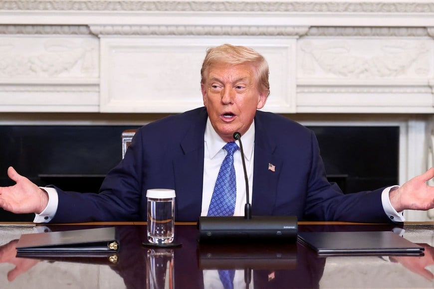 U.S. President Donald Trump gestures during a trilateral signing event with Armenia's Prime Minister Nikol Pashinyan and Azerbaijan's President Ilham Aliyev (not pictured), at the White House, in Washington, D.C., August 8, 2025. REUTERS/Kevin Lamarque