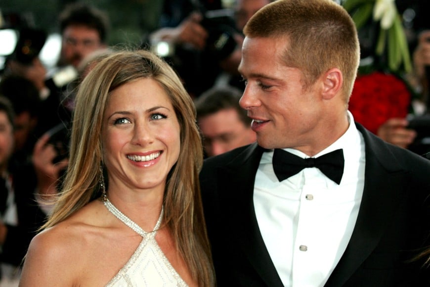 Actors Jennifer Aniston and Brad Pitt arrive for the screening of Wolfang Petersen's "Troy" at the 57th Cannes Film Festival, May 13, 2004.  Reuters Photographer Eric Gaillard first photographed the festival forty years ago.  REUTERS/Eric Gaillard   SEARCH "GAILLARD FORTY YEARS" FOR THIS STORY. SEARCH "WIDER IMAGE" FOR ALL STORIES.