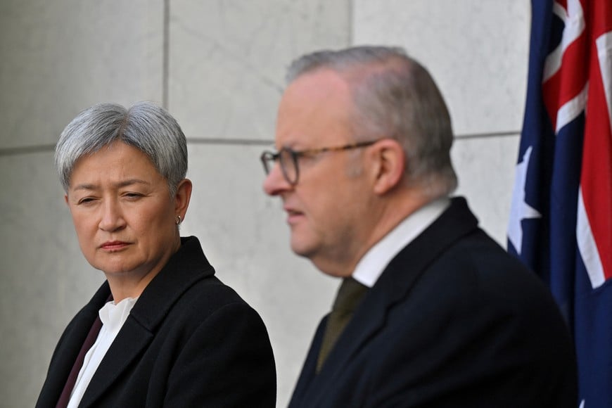 Australian Minister for Foreign Affairs Penny Wong looks on as Prime Minister Anthony Albanese speaks during a press conference at Parliament House in Canberra, Australia, August 11, 2025. Prime Minister Albanese says Australia will recognise a Palestinian state at UN general assembly. AAP/Mick Tsikas via REUTERS    ATTENTION EDITORS - THIS IMAGE WAS PROVIDED BY A THIRD PARTY. NO RESALES. NO ARCHIVE. AUSTRALIA OUT. NEW ZEALAND OUT. NO COMMERCIAL OR EDITORIAL SALES IN NEW ZEALAND. NO COMMERCIAL OR EDITORIAL SALES IN AUSTRALIA.
