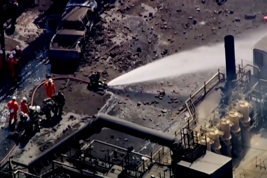 Firefighters spray water on the site of an explosion at U.S. Steel's Clairton Coke Works plant in Clairton, Pennsylvania, U.S. August 11, 2025 in this screengrab obtained from an aerial video.  ABC Affiliate WTAE via REUTERS. NO RESALES. NO ARCHIVES. THIS IMAGE HAS BEEN SUPPLIED BY A THIRD PARTY.  BEST QUALITY AVAILABLE.