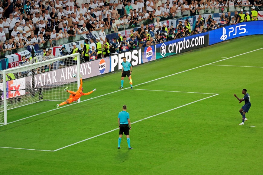 Soccer Football - UEFA Super Cup - Final - Paris St Germain v Tottenham Hotspur - Bluenergy Stadium, Udine, Italy - August 13, 2025
Paris Saint Germain's Nuno Mendes scores a penalty during the penalty shootout REUTERS/Remo Casilli     TPX IMAGES OF THE DAY