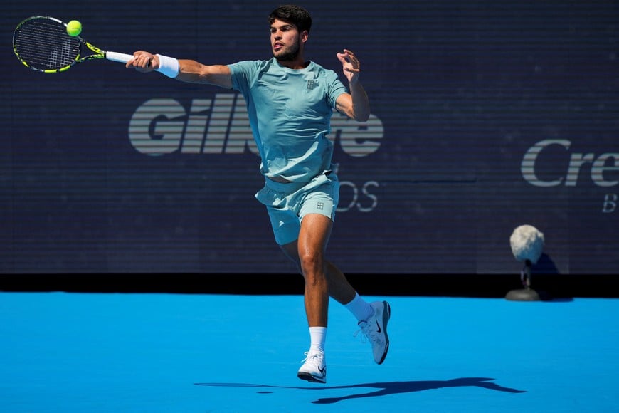 Aug 18, 2025; Cincinnati, OH, USA;  Carlos Alcaraz (ESP) returns a shot against Jannik Sinner (ITA) during the Cincinnati Open at the Lindner Family Tennis Center. Mandatory Credit: Aaron Doster-Imagn Images