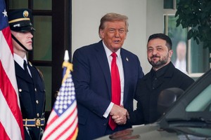 U.S. President Donald Trump greets Ukrainian President Volodymyr Zelenskiy as he arrives at the White House amid negotiations to end the Russian war in Ukraine, in Washington, D.C., U.S., August 18, 2025. REUTERS/Nathan Howard     TPX IMAGES OF THE DAY