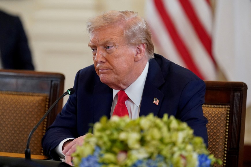 U.S. President Donald Trump listens during a meeting with Ukrainian President Volodymyr Zelenskiy (not pictured) and European leaders amid negotiations to end the Russian war in Ukraine, at the White House in Washington, D.C., U.S., August 18, 2025. REUTERS/Alexander Drago