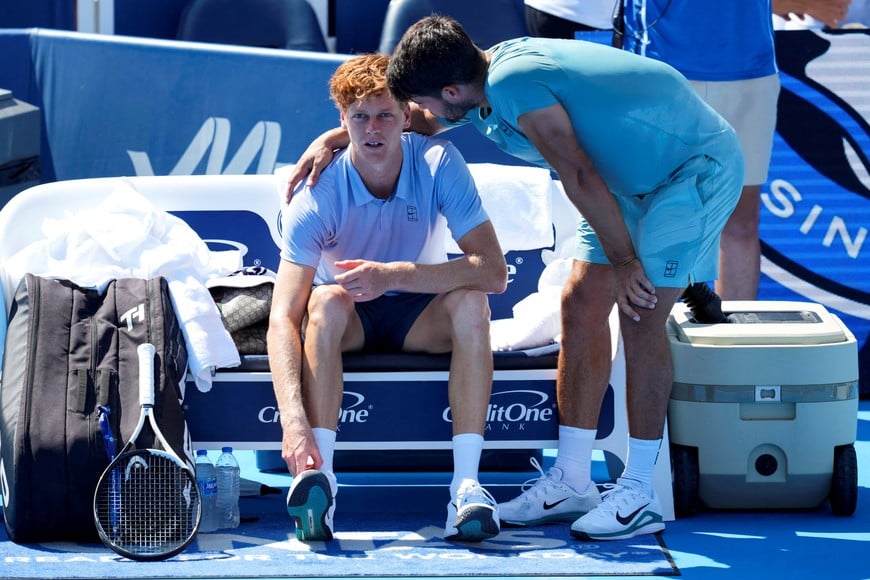 Aug 18, 2025; Cincinnati, OH, USA;  Jannik Sinner (ITA), left, talks with Carlos Alcaraz (ESP) after retiring from their match during the Cincinnati Open at the Lindner Family Tennis Center. Mandatory Credit: Aaron Doster-Imagn Images     TPX IMAGES OF THE DAY