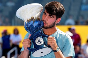Aug 18, 2025; Cincinnati, OH, USA;  Carlos Alcaraz (ESP) poses for a photo with the Rookwood Cup after his match against Jannik Sinner (ITA) during the Cincinnati Open at the Lindner Family Tennis Center. Mandatory Credit: Aaron Doster-Imagn Images     TPX IMAGES OF THE DAY