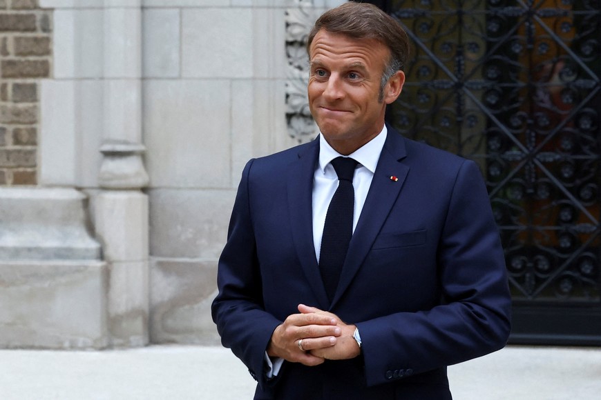 French President Emmanuel Macron speaks with the media after a meeting with U.S. President Donald Trump, Ukrainian President Volodymyr Zelenskiy and European leaders, amid negotiations to end the Russian war in Ukraine, at French Ambassador's residence in Washington, D.C., U.S., August 18, 2025. REUTERS/Yves Herman/Pool