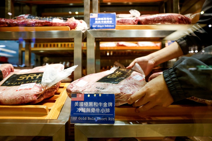 A staff member organizes U.S. imported beef at a supermarket, as the U.S. prepares to announce tariffs on Taiwan, in Taipei, Taiwan July 31, 2025. REUTERS/Ann Wang