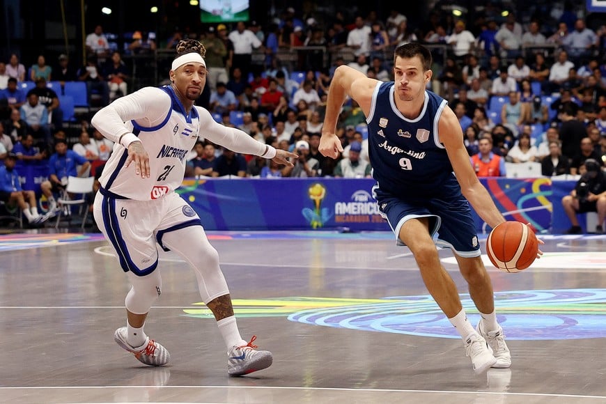 Basketball - FIBA AmeriCup 2025 - Group C - Nicaragua v Argentina - Polideportivo Alexis Arguello, Managua, Nicaragua - August 22, 2025
Argentina's Julian Alvarez in action with Nicaragua's Jared Ruiz REUTERS/Luisa Gonzalez