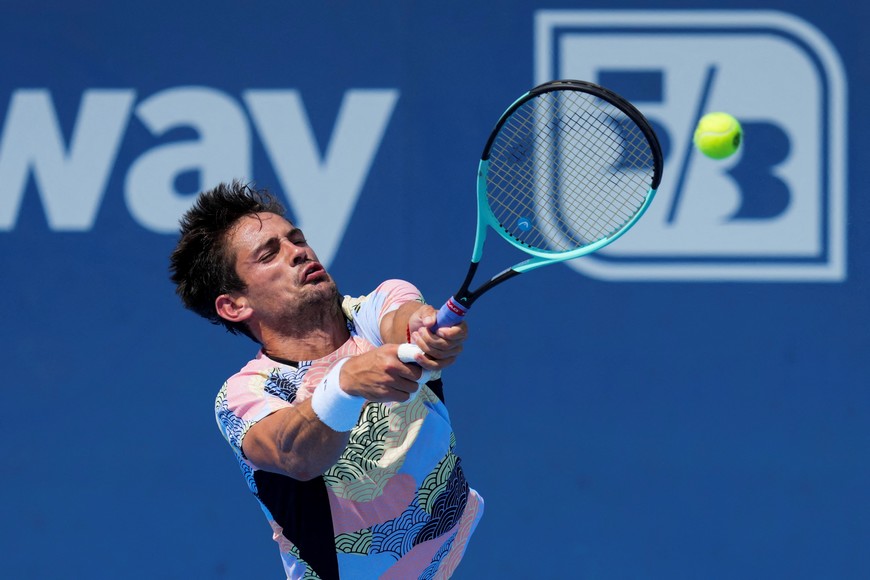 Aug 6, 2025; Cincinnati, OH, USA; Mariano Navone (ARG) returns a shot against Jan-Lennard Struff (GER) during the Cincinnati Open at the Lindner Family Tennis Center. Mandatory Credit: Aaron Doster-Imagn Images