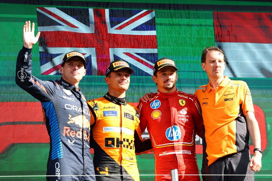 Formula One F1 - Dutch Grand Prix - Circuit Zandvoort, Zandvoort, Netherlands - August 25, 2024
McLaren's Lando Norris celebrates on the podium after winning the Dutch Grand Prix alongside second placed Red Bull's Max Verstappen and third placed Ferrari's Charles Leclerc REUTERS/Lisi Niesner