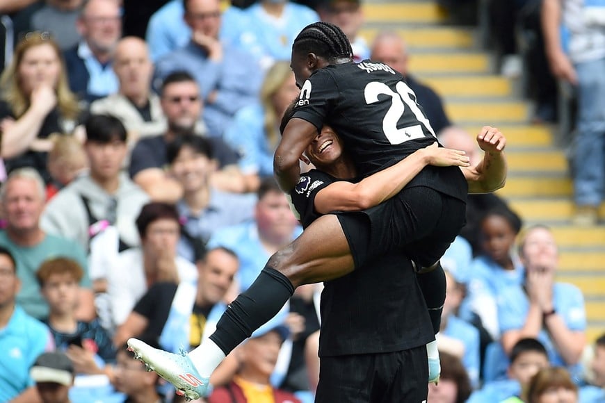 Soccer Football - Premier League - Manchester City v Tottenham Hotspur - Etihad Stadium, Manchester, Britain - August 23, 2025 
Tottenham Hotspur's Joao Palhinha celebrates scoring their second goal with Tottenham Hotspur's Mohammed Kudus REUTERS/Peter Powell EDITORIAL USE ONLY. NO USE WITH UNAUTHORIZED AUDIO, VIDEO, DATA, FIXTURE LISTS, CLUB/LEAGUE LOGOS OR 'LIVE' SERVICES. ONLINE IN-MATCH USE LIMITED TO 120 IMAGES, NO VIDEO EMULATION. NO USE IN BETTING, GAMES OR SINGLE CLUB/LEAGUE/PLAYER PUBLICATIONS. PLEASE CONTACT YOUR ACCOUNT REPRESENTATIVE FOR FURTHER DETAILS..