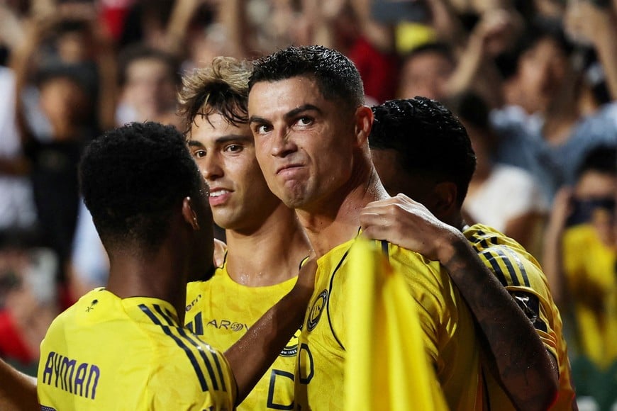 Soccer Football - Saudi Super Cup - Final - Al Nassr v Al Ahli - Hong Kong Stadium, Hong Kong, China - August 23, 2025 
Al Nassr's Cristiano Ronaldo celebrates scoring their first goal with teammates REUTERS/Tyrone Siu     TPX IMAGES OF THE DAY