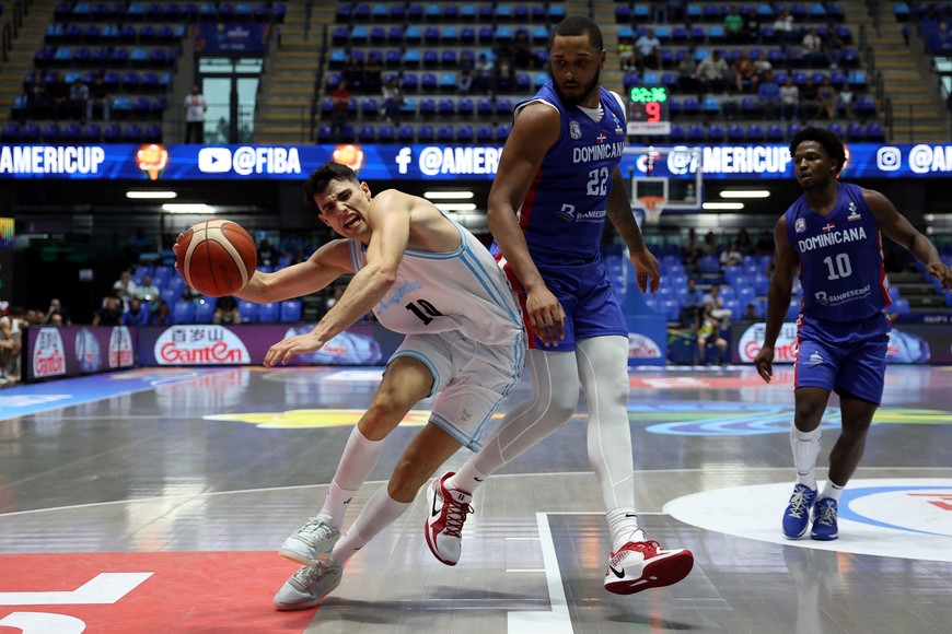Basketball - FIBA AmeriCup 2025 - Group C - Argentina v Dominican Republic - Polideportivo Alexis Arguello, Managua, Nicaragua - August 24, 2025
Argentina's Gonzalo Corbalan in action with Dominican Republic's Joel Soriano REUTERS/Luisa Gonzalez