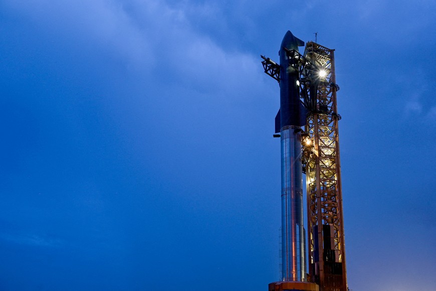 A SpaceX Starship spacecraft sits atop a super heavy booster at the launch pad before its scheduled tenth test flight, at the company's complex in Starbase, Texas, U.S., August 24, 2025. REUTERS/Steve Nesius