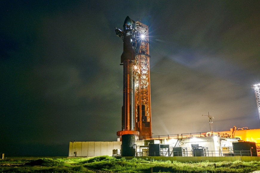 A SpaceX Starship spacecraft sits atop a super heavy booster at the launch pad before its scheduled tenth test flight, at the company's complex in Starbase, Texas, U.S., August 24, 2025. REUTERS/Steve Nesius
