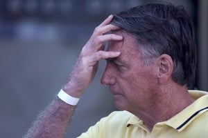 FILE PHOTO: Brazil's former President Jair Bolsonaro leaves a hospital after undergoing medical examinations, authorised by Supreme Court Justice Alexandre de Moraes, to return to house arrest as he awaits trial after being accused of plotting a coup following his electoral defeat, in Brasilia, Brazil, August 16, 2025. REUTERS/Adriano Machado/File Photo