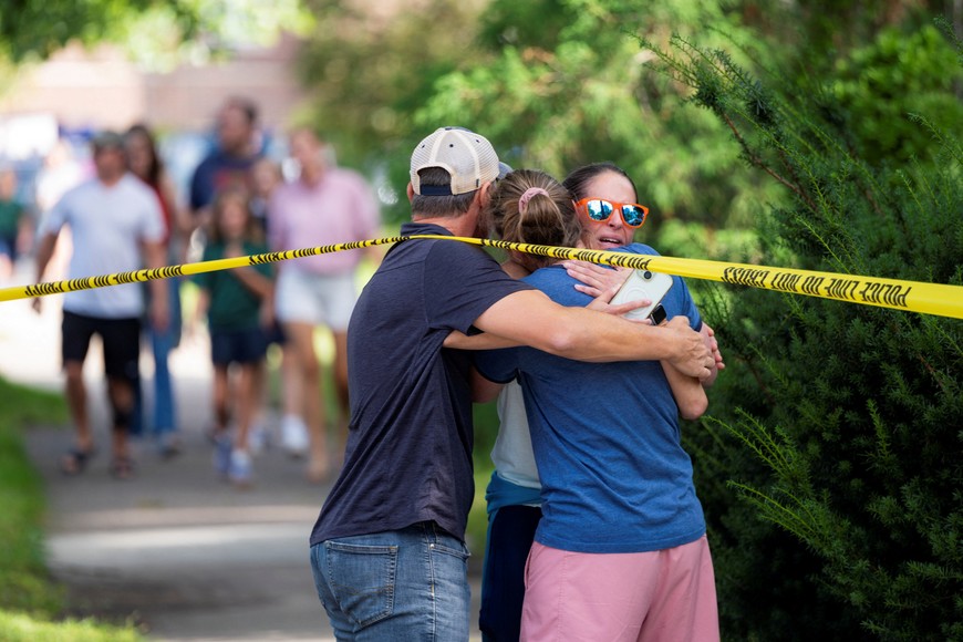 Families and loved ones reunite outside the police barricades after a shooting at Annunciation Church, which is also home to a an elementary school, in Minneapolis, Minnesota, U.S. August 27, 2025. REUTERS/Ben Brewer
TPX IMAGES OF THE DAY