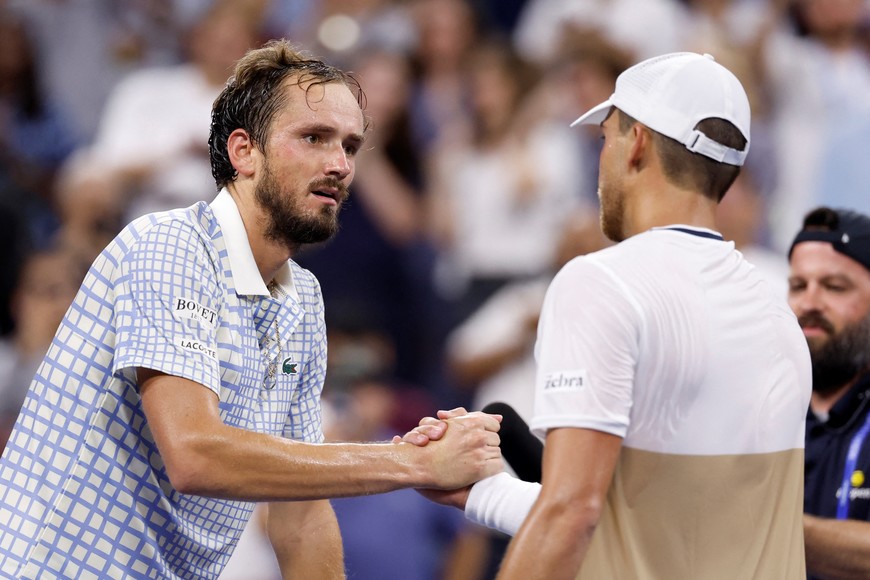 Tennis - U.S. Open - Flushing Meadows, New York, United States - August 25, 2025
France's Benjamin Bonzi shakes hands with Russia's Daniil Medvedev after winning his first round match REUTERS/Eduardo Munoz