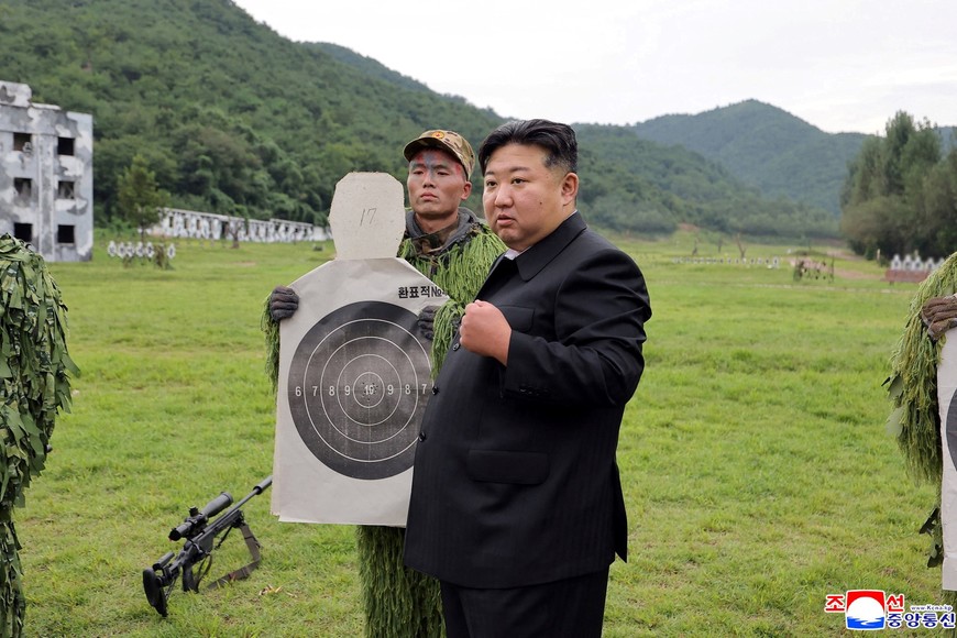North Korean leader Kim Jong Un reacts while inspecting target sheets during a visit to a special operation training base at an undisclosed location in this undated picture released by North Korea's official Korean Central News Agency August 28, 2025.     KCNA via REUTERS    ATTENTION EDITORS - THIS IMAGE WAS PROVIDED BY A THIRD PARTY. REUTERS IS UNABLE TO INDEPENDENTLY VERIFY THIS IMAGE. NO THIRD PARTY SALES. SOUTH KOREA OUT. NO COMMERCIAL OR EDITORIAL SALES IN SOUTH KOREA.     TPX IMAGES OF THE DAY