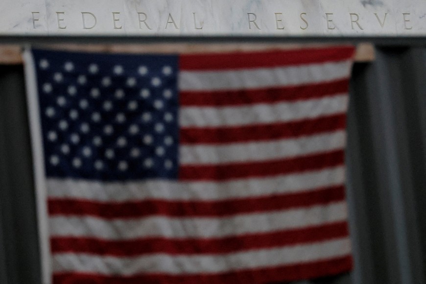 A U.S. flag hangs on a construction trailer outside the U.S. Federal Reserve building, as U.S. President Donald Trump said he was firing Federal Reserve Governor Lisa Cook over alleged improprieties in obtaining mortgage loans, in Washington, D.C., U.S., August 26, 2025.   REUTERS/Brian Snyder     TPX IMAGES OF THE DAY