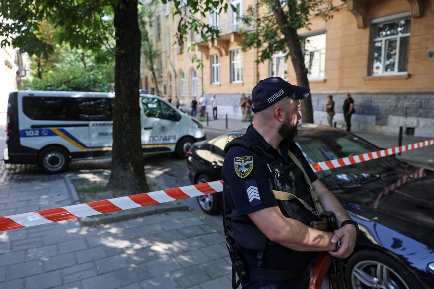 A police officer guards at the site of a murder of former Ukrainian parliamentary speaker Andriy Parubiy, who was killed this morning, amid Russia's attack on Ukraine, in Lviv, Ukraine August 30, 2025. REUTERS/Roman Baluk