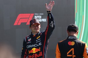 Formula One F1 - Dutch Grand Prix - Circuit Zandvoort, Zandvoort, Netherlands - August 30, 2025
Red Bull's Max Verstappen reacts after qualifying in third position as second placed McLaren's Lando Norris looks on REUTERS/Jakub Porzycki