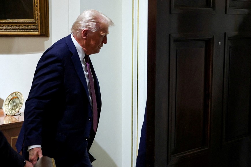 FILE PHOTO: U.S. President Donald Trump leaves, following a cabinet meeting, at the White House in Washington, D.C., U.S.,  August 26, 2025. REUTERS/Jonathan Ernst/File Photo