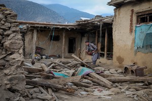 FILE PHOTO: An Afghan man looks for his belongings amidst the rubble of a collapsed house after a deadly magnitude-6 earthquake that struck Afghanistan around midnight, in Dara Noor, in Jalalabad, Afghanistan, September 1, 2025. REUTERS/Sayed Hassib/File Photo
