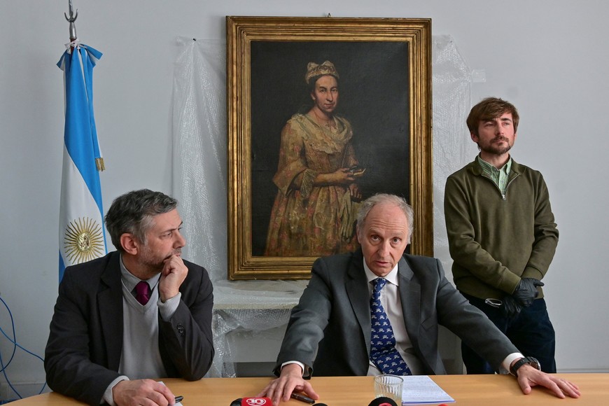 Federal Attorney General of Mar del Plata Daniel Adler listens as Assistant Prosecutor Carlos Martinez addresses the media next to curator Ariel Bassano as a portrait of Contessa Colleoni by Italian artist Giuseppe Ghislandi, hangs on the wall, after Argentina officials recovered the iconic painting stolen decades ago by the Nazis, after it was spotted in a real estate photo, in Mar del Plata, Argentina September 3, 2025. REUTERS/Jose Scalzo