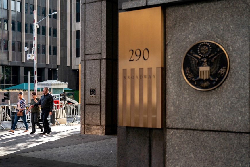 People walk past U.S. immigration court in Manhattan, in New York City, U.S., September 2, 2025. REUTERS/David 'Dee' Delgado