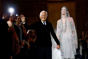 FILE PHOTO: Designer Giorgio Armani appears at the end of his Haute Couture Spring/Summer 2025 collection show for Giorgio Armani Prive in Paris, France, January 28, 2025. REUTERS/Sarah Meyssonnier/File Photo