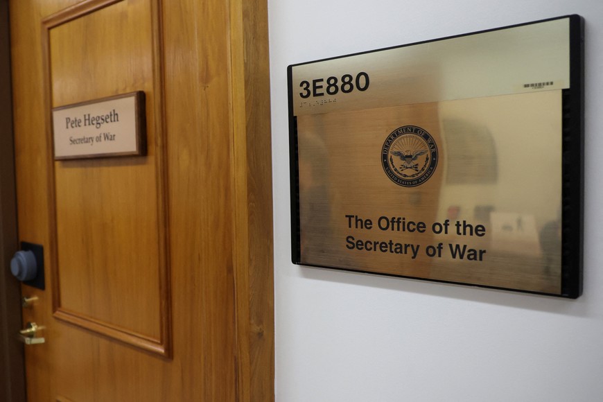 A sign that reads "Pete Hegseth - Secretary of War" is displayed on a door, after U.S. President Donald Trump ordered the Department of Defense to be renamed as the "Department of War," reverting to a title it held until after World War Two when officials sought to emphasize the Pentagon's role in preventing conflict, at the Pentagon in Washington, D.C., U.S., September 5, 2025. REUTERS/Jonathan Ernst