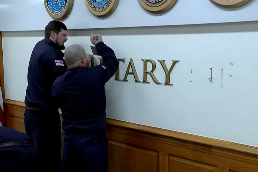 Workers remove signage letters after U.S. President Donald Trump signed an executive order to rename the Department of Defense the "Department of War," reverting to a title it held until after World War Two when officials sought to emphasize the Pentagon's role in preventing conflict, in this video screengrab, in Washington, D.C., September 5, 2025.  Reuters TV/Pool