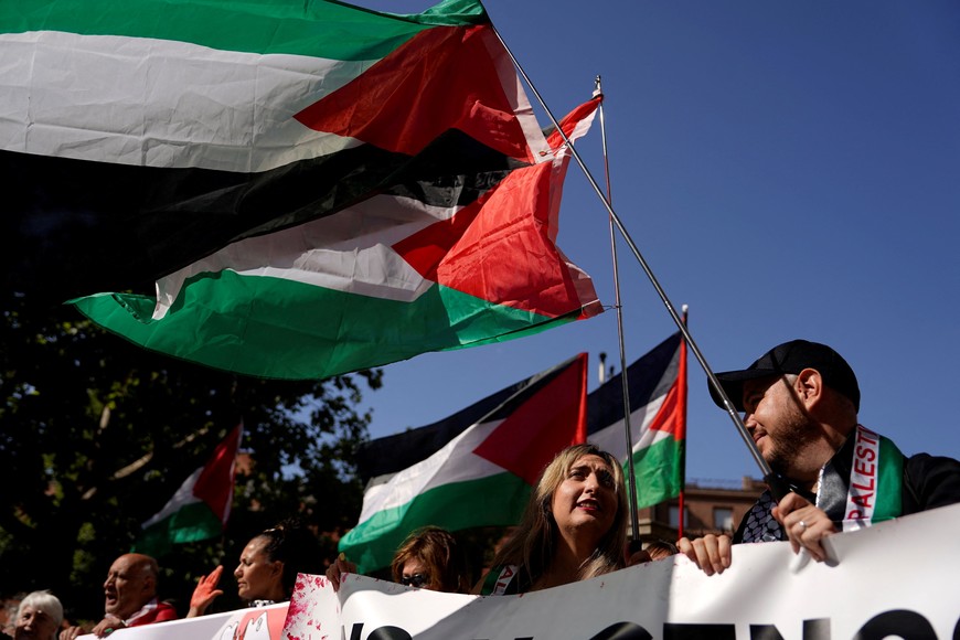People with Palestinian flags demonstrate in support of Global Sumud Flotilla, a humanitarian aid expedition destined for Gaza, in front of Israel embassy in Madrid, Spain, September 6, 2025. REUTERS/Ana Beltran