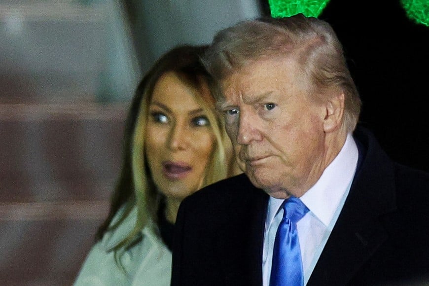 U.S President Donald Trump and first lady Melania Trump arrive at Fiumicino Airport, to attend the funeral of Pope Francis, near Rome, Italy, April 25, 2025. REUTERS/Guglielmo Mangiapane