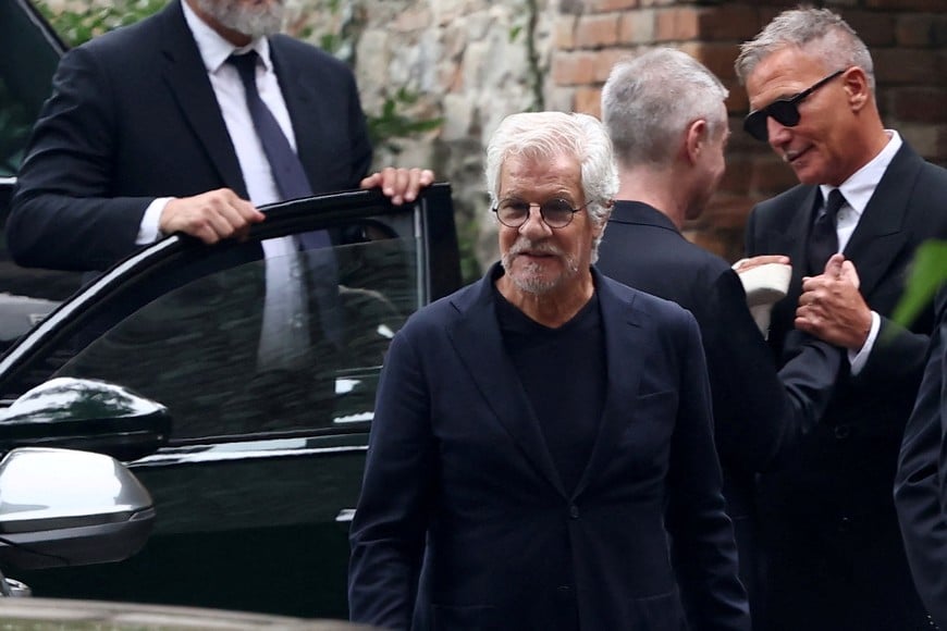 Leo Dell'Orco leaves after attending Giorgio Armani's private funeral ceremony at San Martino church in Rivalta, Italy September 8, 2025. REUTERS/Gonzalo Fuentes