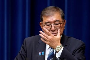 FILE PHOTO: Japanese Prime Minister Shigeru Ishiba adjusts his glasses during a press conference as he announces his resignation, in Tokyo, Japan September 7, 2025. Toru Hanai/Pool via REUTERS/File Photo