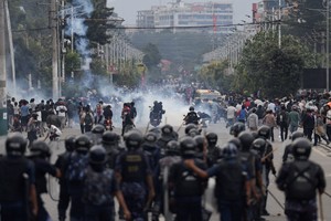 Riot police personnel chase demonstrators during a protest against corruption and the government's decision to block several social media platforms, in Kathmandu, Nepal, September 8, 2025. REUTERS/Navesh Chitrakar