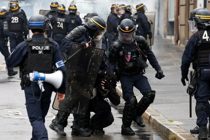 A protester is detained by French CRS riot police during a demonstration in Nantes, as part of a grassroots protest movement called "Bloquons Tout" ("Let's Block Everything") calling for nationwide all-day disruption, France, September 10, 2025. REUTERS/Stephane Mahe