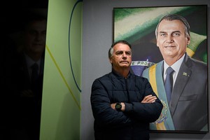 Former Brazilian President Jair Bolsonaro poses for a picture after an interview with Reuters in Brasilia, Brazil, July 18, 2025. REUTERS/Mateus Bonomi